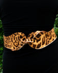 Close-up of the Esquel Belt in animal print, styled over black.