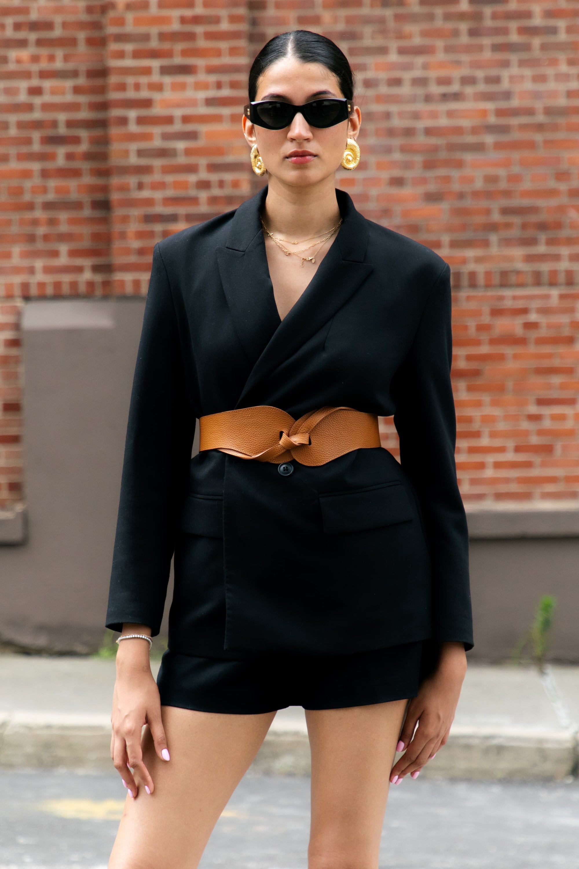 Back view of the Esquel Belt in caramel leather, tied at the front.
